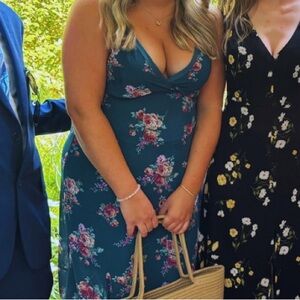 Emerald green wedding guest dress.